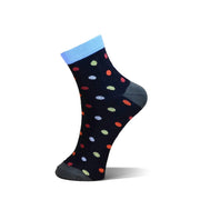 A single ankle sock on a white background, featuring a navy blue base with multicolored polka dots, a light blue cuff, and a dark gray heel and toe.