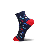 A single ankle sock on a white background, featuring a navy blue base with a colorful geometric triangle pattern and bright red heels and toes.