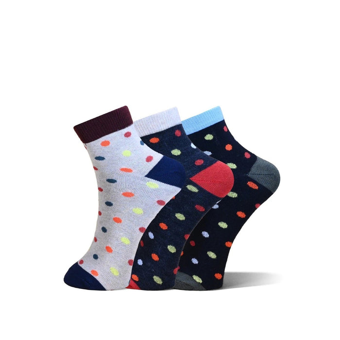 Three pairs of ankle socks with colorful polka dots, displayed in a fan arrangement on a white background. The socks feature different colorways: one light gray with multicolor dots, one navy blue with multicolor dots and a red heel accent, and one navy blue with multicolor dots and a light blue cuff.