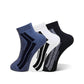 Three pairs of low-cut ankle socks arranged in a fan shape on a white background. The socks are in blue, white, and black, each featuring a bold curved stripe pattern on the side.